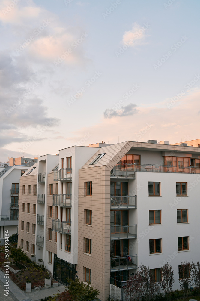 modern beautiful apartment house in European city. with bright facade and balconies.