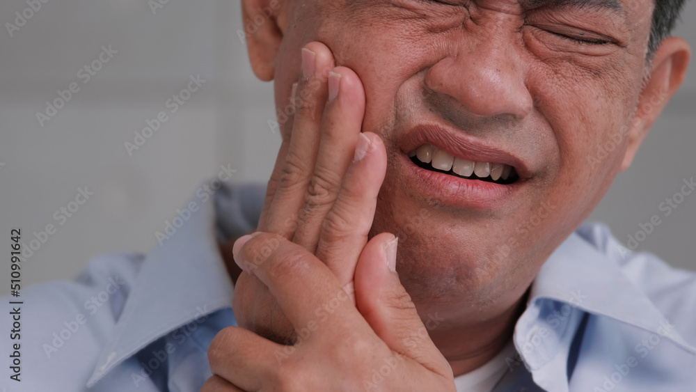 Fototapeta premium Asian senior man suffering from toothache.
