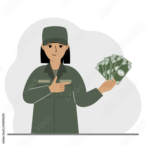 Military woman holds a lot of money in his hand. The concept of payment for military service or service in the army under a contract.