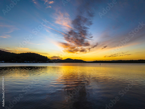 High cloud sunrise at the waterfront