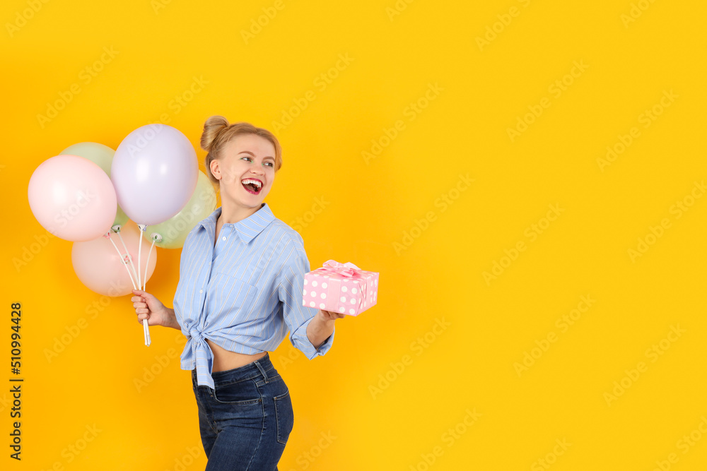 Concept of Happy Birthday with attractive girl on yellow background Concept of Happy Birthday with attractive girl on yellow background