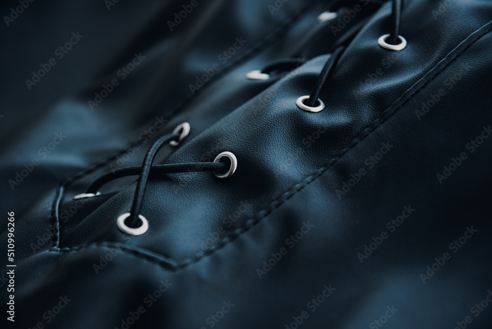 close up of black eco leather with laces