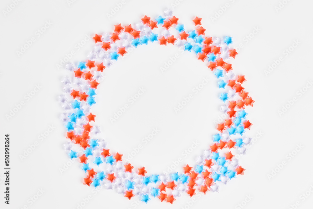 beautiful frame of blue, red and transparent stars on a white background. banner for the celebration of Independence Day on July 4th. space for text, flat lay beautiful frame of blue, red and transparent stars on a white background. banner for the celebration of Independence Day on July 4th. space for text, flat lay