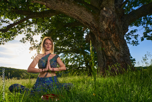 Young woman yoga practitioner in the forest © Xalanx