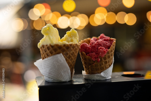 Ice cream in waffle cone on a store counter
