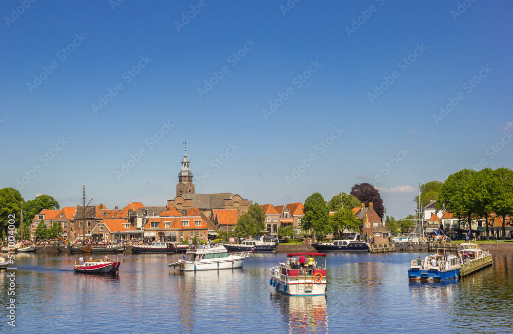 Ships waiting for the lock in historic fishing village Blokzijl, Netherlands