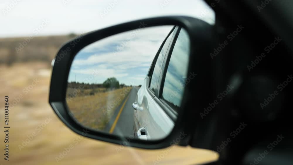 A rearview mirror through which you can see the road and the surroundings. Filmed while driving from the car. A rearview mirror through which you can see the road and the surroundings. Filmed while driving from the car.