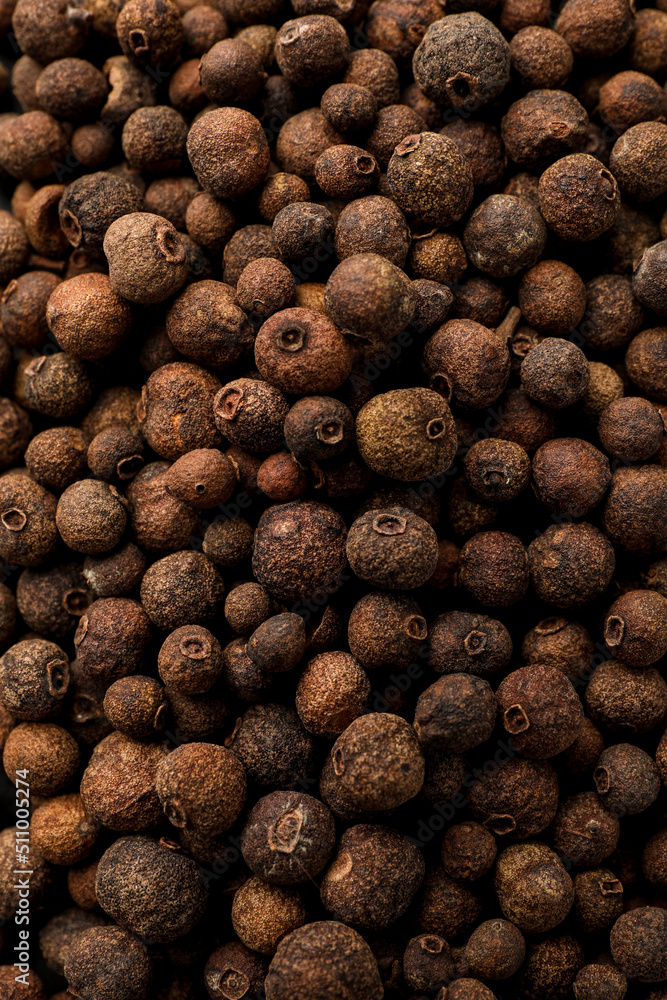 Aromatic allspice grains as background, top view Aromatic allspice grains as background, top view