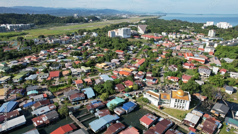 Kota Kinabalu, Sabah Malaysia – June 15, 2022: The Tanjung Aru Beach, Fisherman Village and Shangri-La Hotel Kota Kinabalu, Sabah Malaysia – June 15, 2022: The Tanjung Aru Beach, Fisherman Village and Shangri-La Hotel