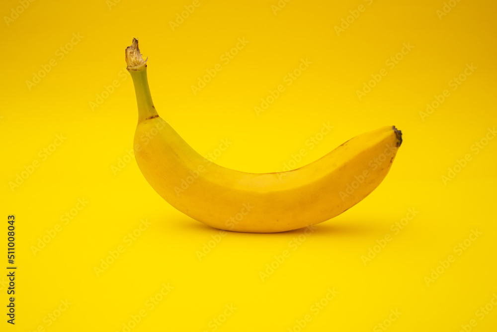 Bananas on yellow background, monochrome Bananas on yellow background, monochrome