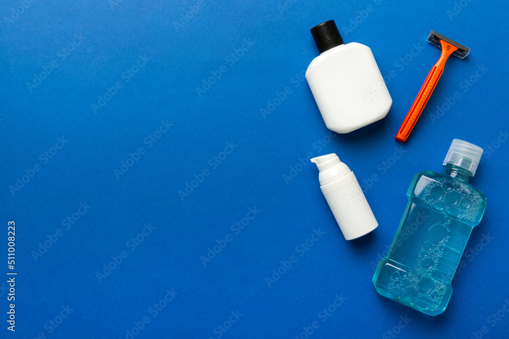 Composition with bath cosmetics on table. razor, toothpaste, soap, gel, toothbrush, mouthwash and other various accessories. Cosmetics for skin health. Bath Mockup for your logo Composition with bath cosmetics on table. razor, toothpaste, soap, gel, toothbrush, mouthwash and other various accessories. Cosmetics for skin health. Bath Mockup for your logo