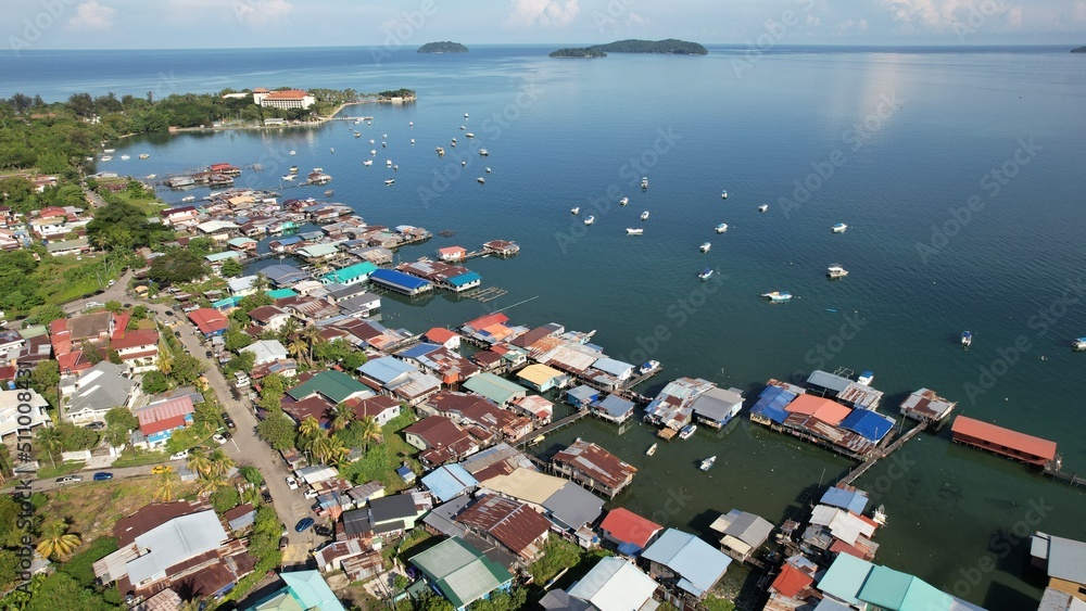 Kota Kinabalu, Sabah Malaysia – June 15, 2022: The Tanjung Aru Beach, Fisherman Village and Shangri-La Hotel Kota Kinabalu, Sabah Malaysia – June 15, 2022: The Tanjung Aru Beach, Fisherman Village and Shangri-La Hotel