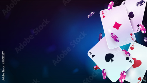 Casino playing cards with poker chips on blue blurred background