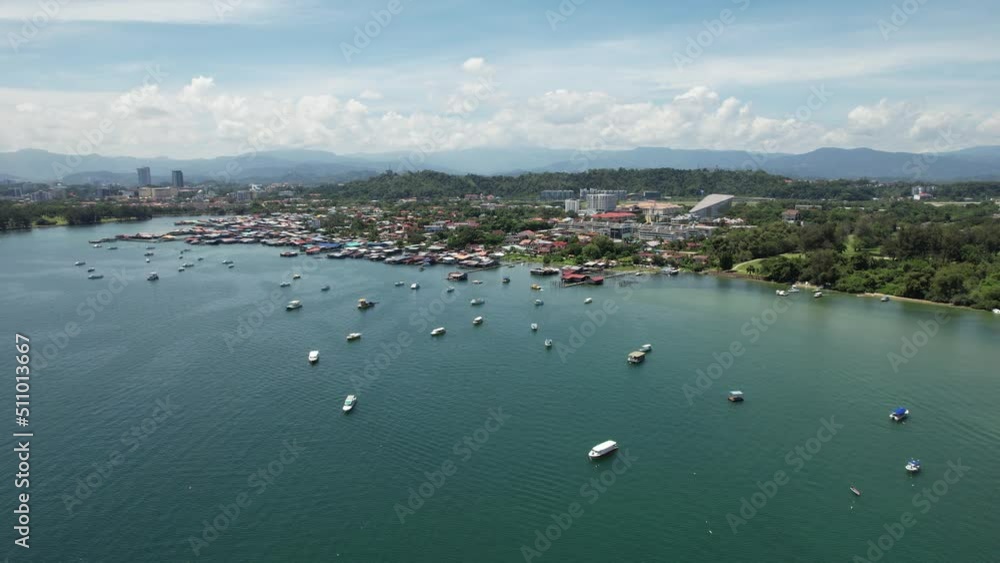Kota Kinabalu, Sabah Malaysia – June 15, 2022: The Tanjung Aru Beach, Fisherman Village and Shangri-La Hotel Kota Kinabalu, Sabah Malaysia – June 15, 2022: The Tanjung Aru Beach, Fisherman Village and Shangri-La Hotel