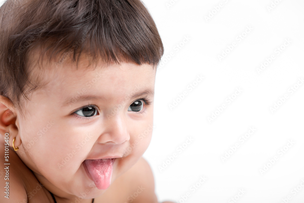 Indian baby girl playing on white background. Indian baby girl playing on white background.