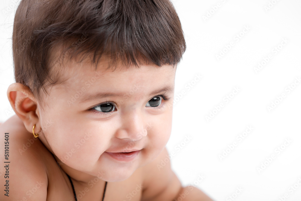 Indian baby girl playing on white background. Indian baby girl playing on white background.