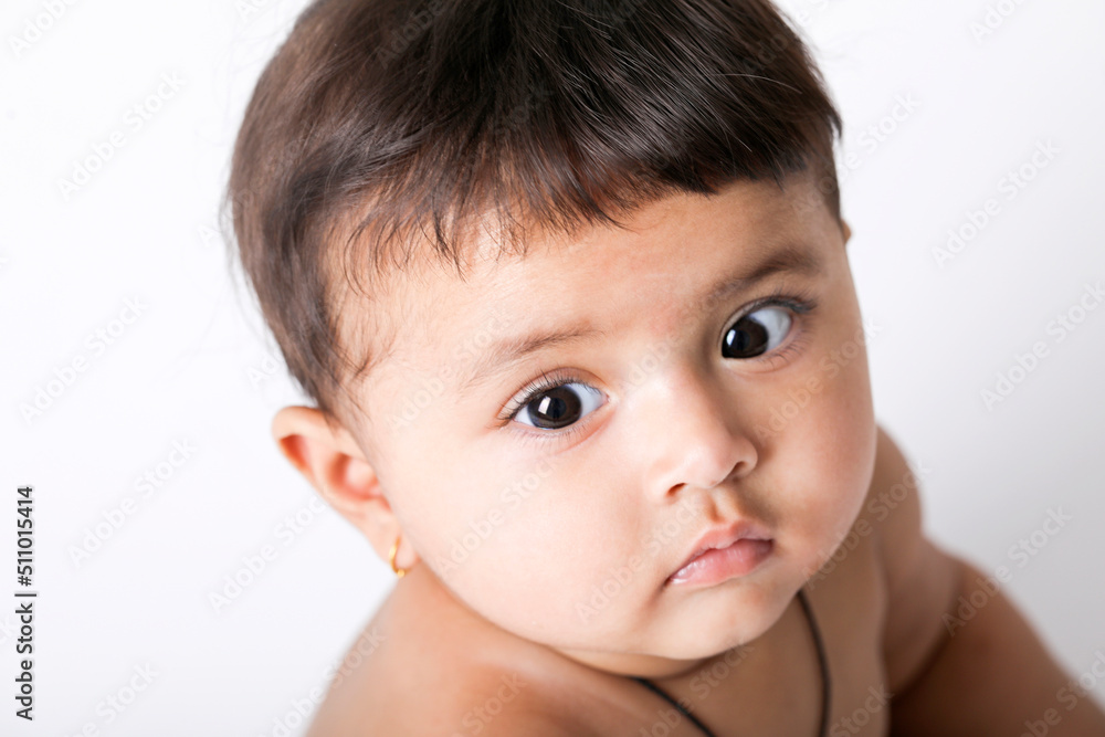 Indian baby girl playing on white background. Indian baby girl playing on white background.