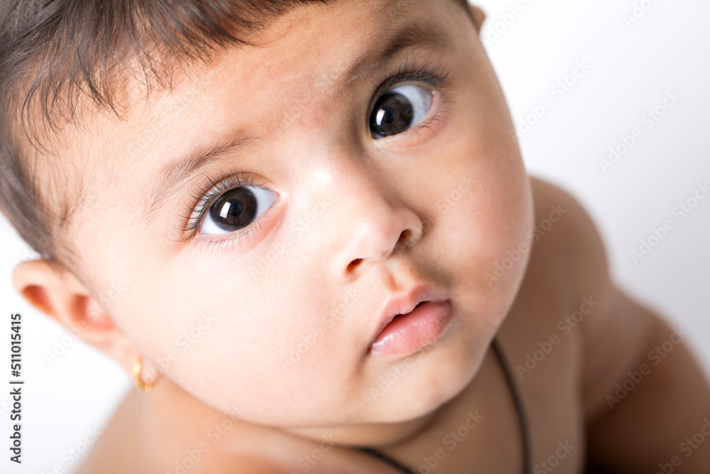 Indian baby girl playing on white background. Indian baby girl playing on white background.