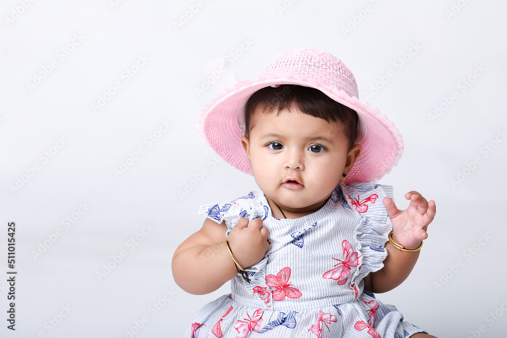 Indian baby girl sitting on white background. Indian baby girl sitting on white background.