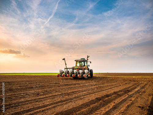 Fotografie, Obraz Tractor drilling seeding crops at farm field