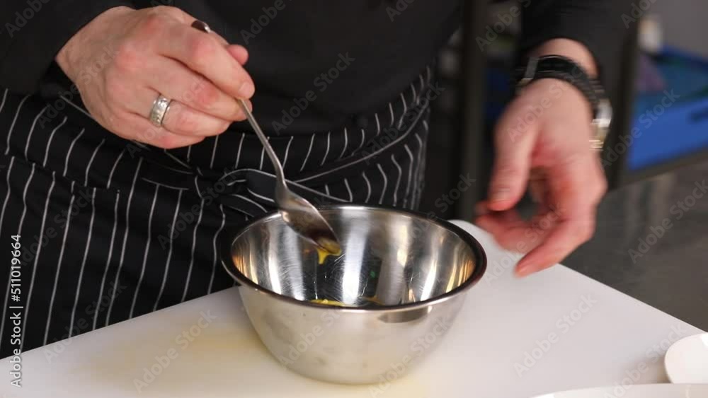 chef preparing tasty food on kitchen table chef preparing tasty food on kitchen table