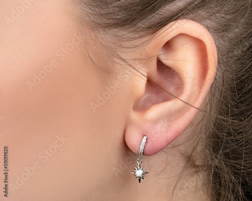 Valokuvatapetti jewelry earrings on white background isolated