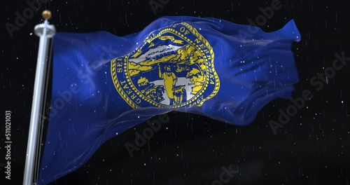Flag of american state of Nebraska, United States, with rain in the night. Loop photo