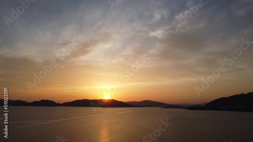 SDGs！輝く海面と太陽のHIKARI　地球の神秘な空模様 ドローン 空撮 © YuAiru