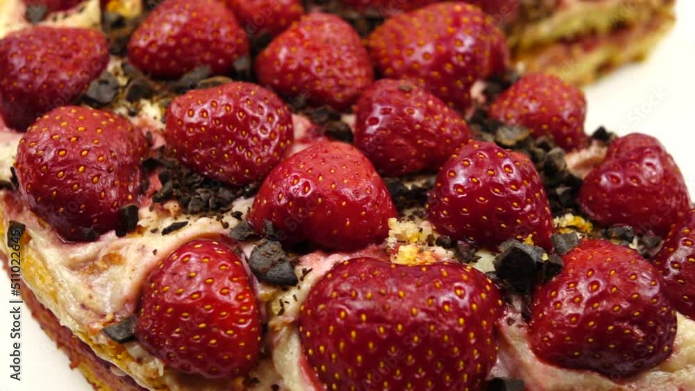 Freshly baked strawberry pie on the dish, homemade pastries, slow motion