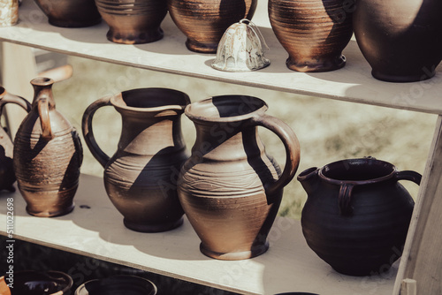 Clay jars at the market for food. Fototapet