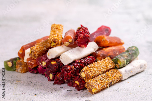 Turkish delight varieties on a concrete floor. Traditional Turkish delicacies. local name parmak lokum. close up photo