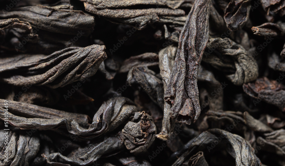 Dried black tea leaves as background. Dried black tea leaves as background.