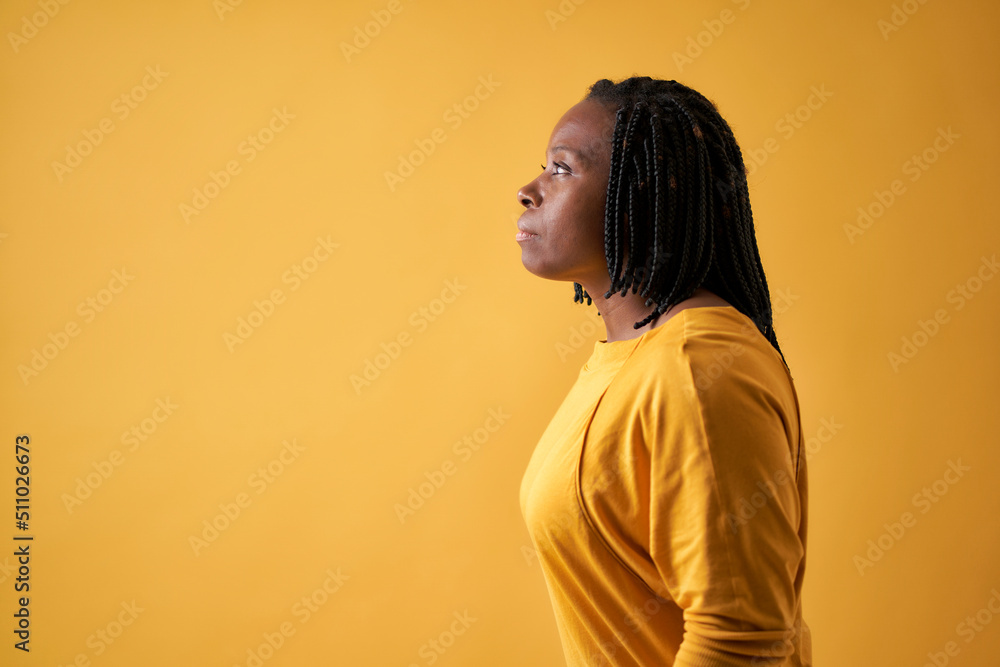 portrait of a serious black woman seen from the side portrait of a serious black woman seen from the side