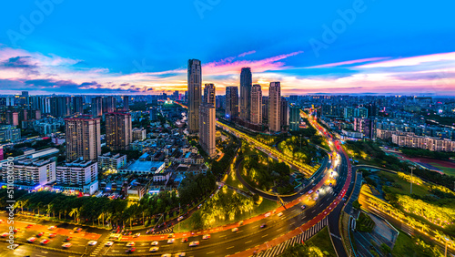 Haikou Cityscape with Landmark Buildings and Urban Overpass during Evening Blue Hours, Hainan Province, the Largest Free Trade Zone in China.