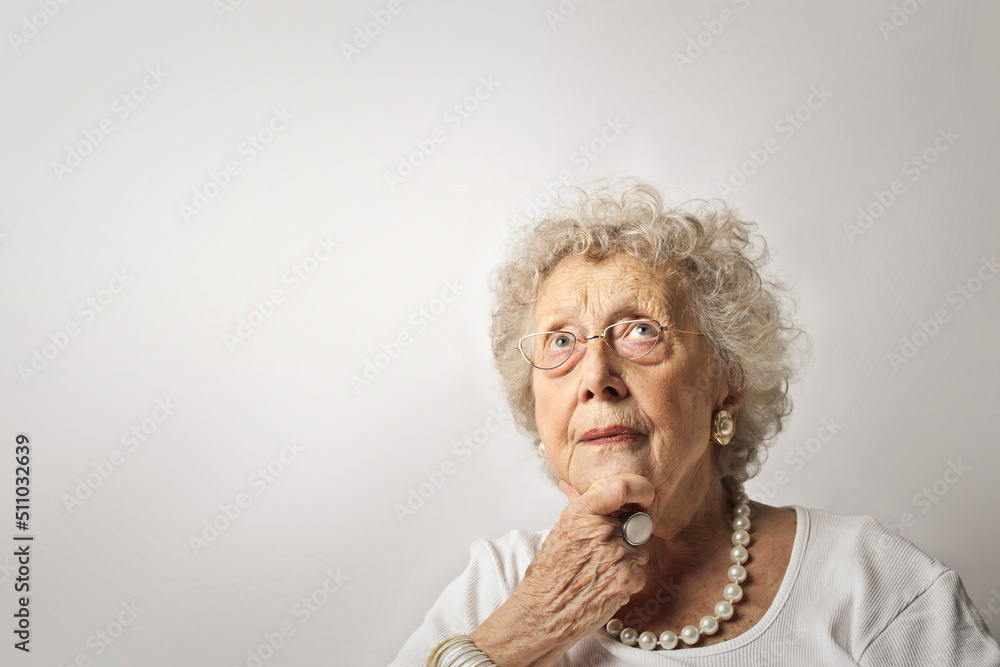 portrait of elderly woman with thoughtful expression portrait of elderly woman with thoughtful expression
