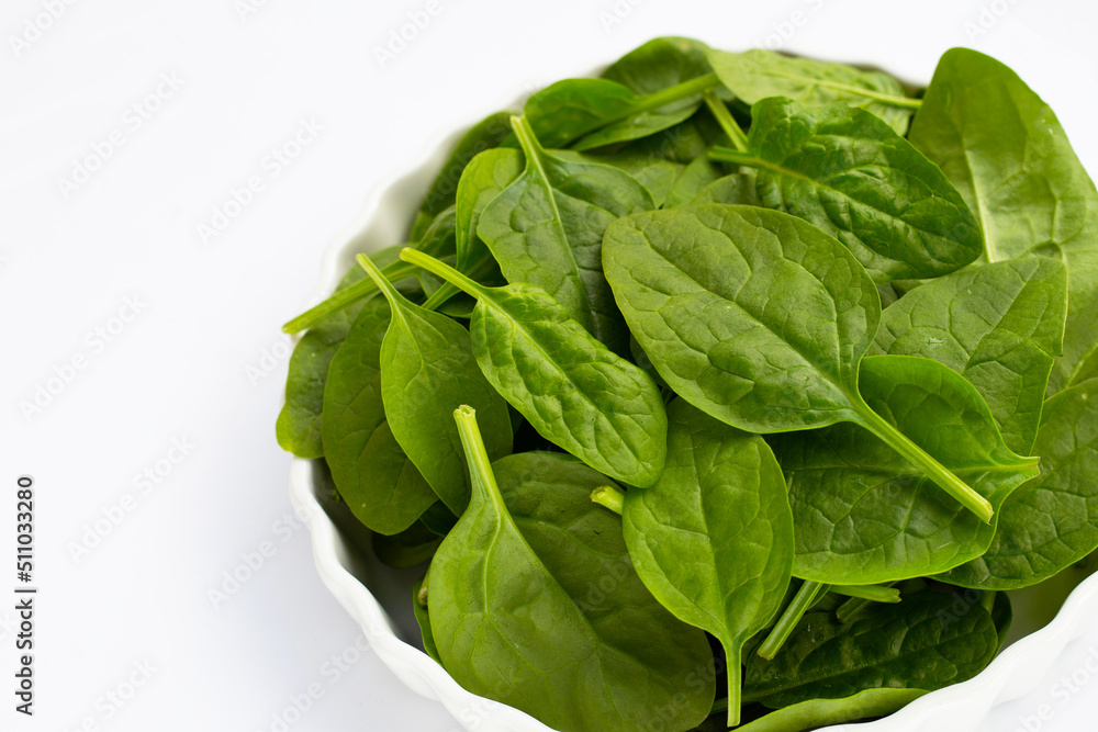 Fototapeta premium Spinach leaves on white background.