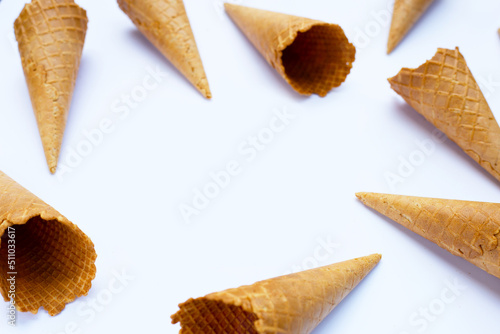 Frame made of empty ice cream cone on white background.
