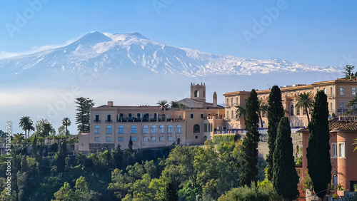 Fotografie, Obraz Luxury San Domenico Palace Hotel with panoramic view on snow capped Mount Etna v