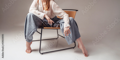 Girl in a stylish chair. Beautiful female model