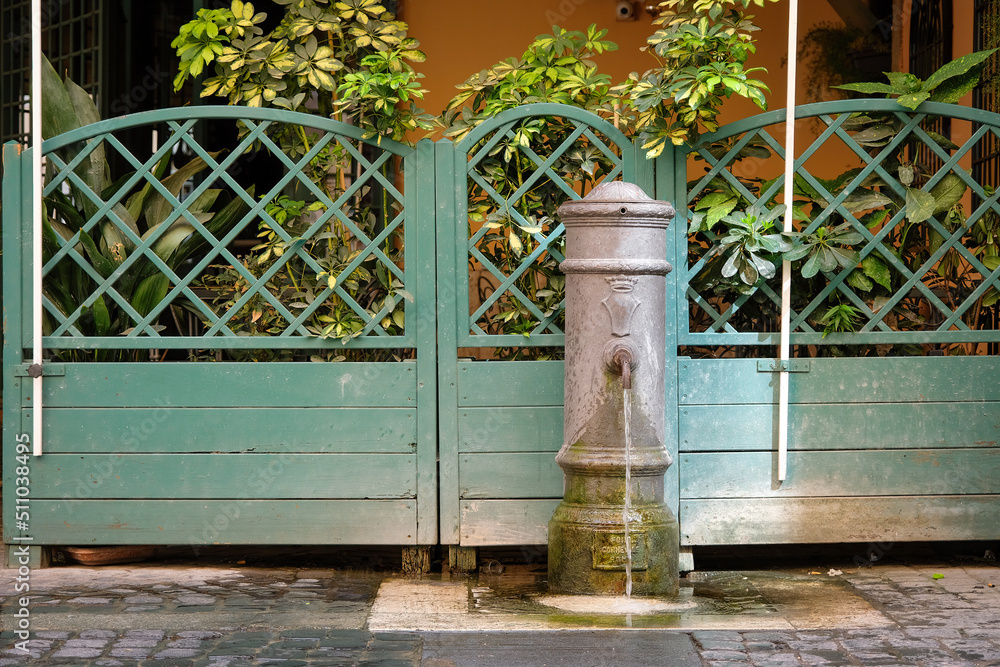 Traditional drinking water fountain in Rome, Italy.