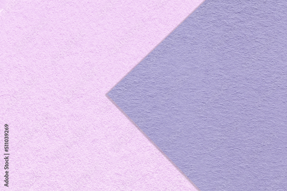 Texture of purple and lilac paper background, half two colors with arrow, macro. Structure of violet craft cardboard. Texture of purple and lilac paper background, half two colors with arrow, macro. Structure of violet craft cardboard.