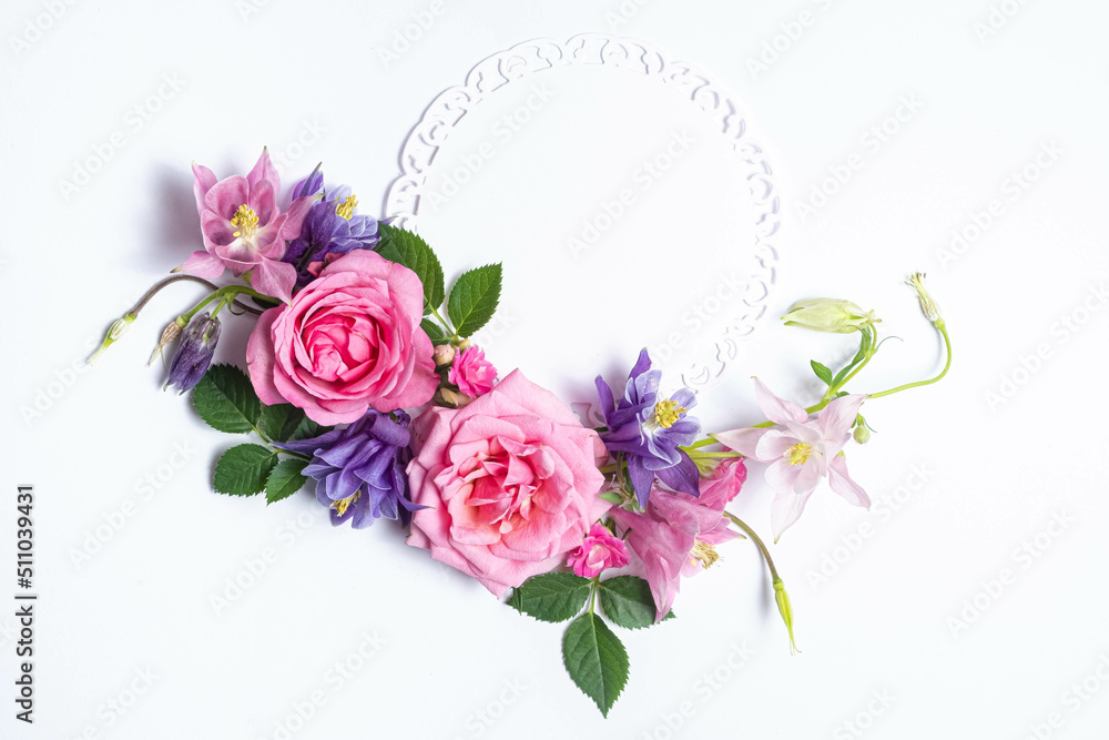Flowers mockup from round paper card and pink rose and aquilegia isolated. Top view, flat lay.