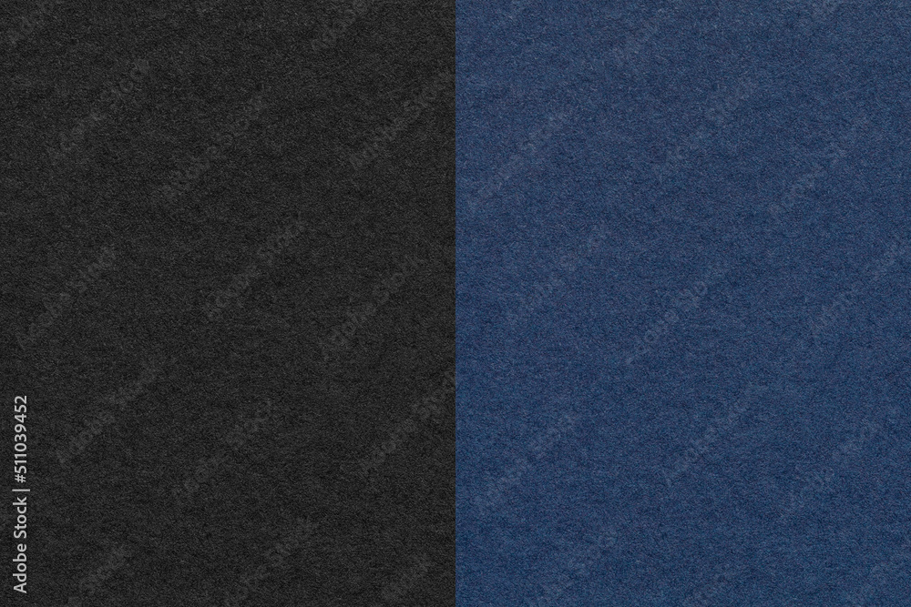 Texture of craft black and navy blue paper background, half two colors, macro. Structure of vintage dense cardboard.