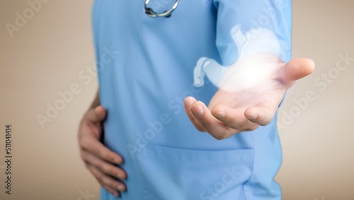 A doctor holding virtual Intestine in hand. Healthcare hospital service concept photo