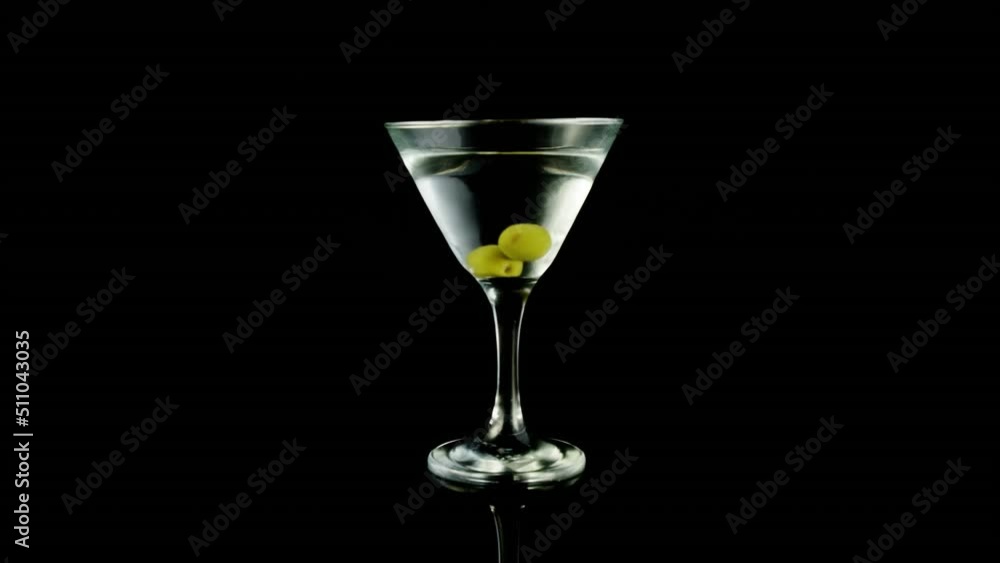 Video of glass of martini on black background Video of glass of martini on black background