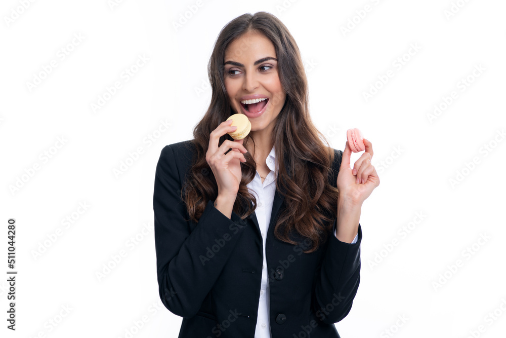 Charming woman want to bite tasty macaron, holding macaroon near open mouth, beauty girl enjoying sweets. Charming woman want to bite tasty macaron, holding macaroon near open mouth, beauty girl enjoying sweets.