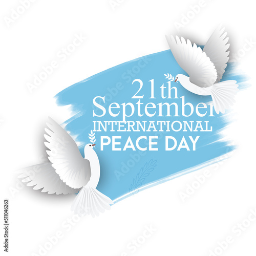 International Day of Peace, with dove and symbol of peace on blue background photo