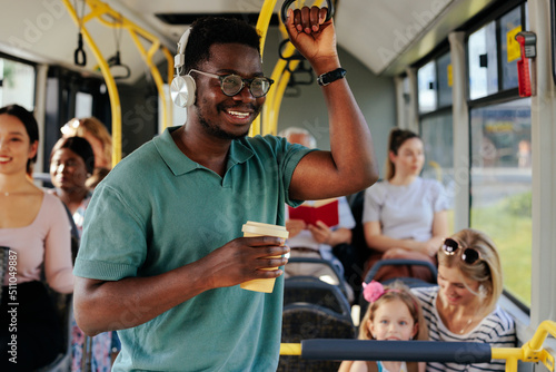 Tablou pe pânză Happy african american rides public transportation