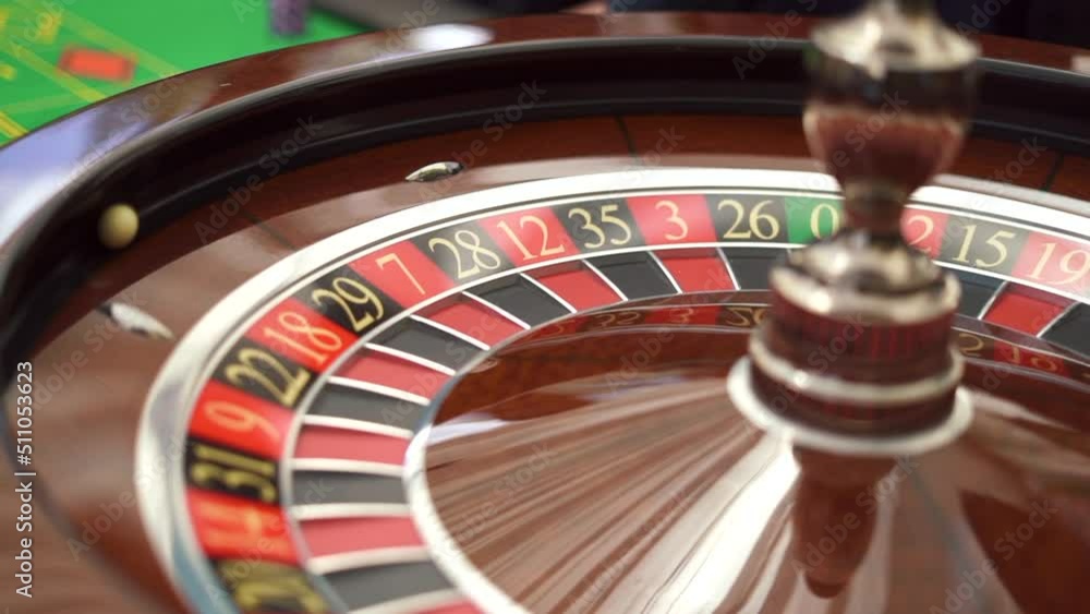 The small ball rolling into the slot as the Roulette Wheel spins. Casino concept. High quality FullHD footage The small ball rolling into the slot as the Roulette Wheel spins. Casino concept. High quality FullHD footage