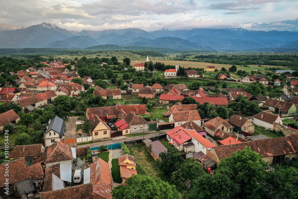 Transylvanian old village of Porumbacu photographed from drone with Fagaras mountains in the background